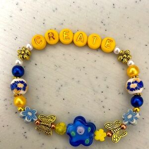 Create bracelet in blue and yellow.